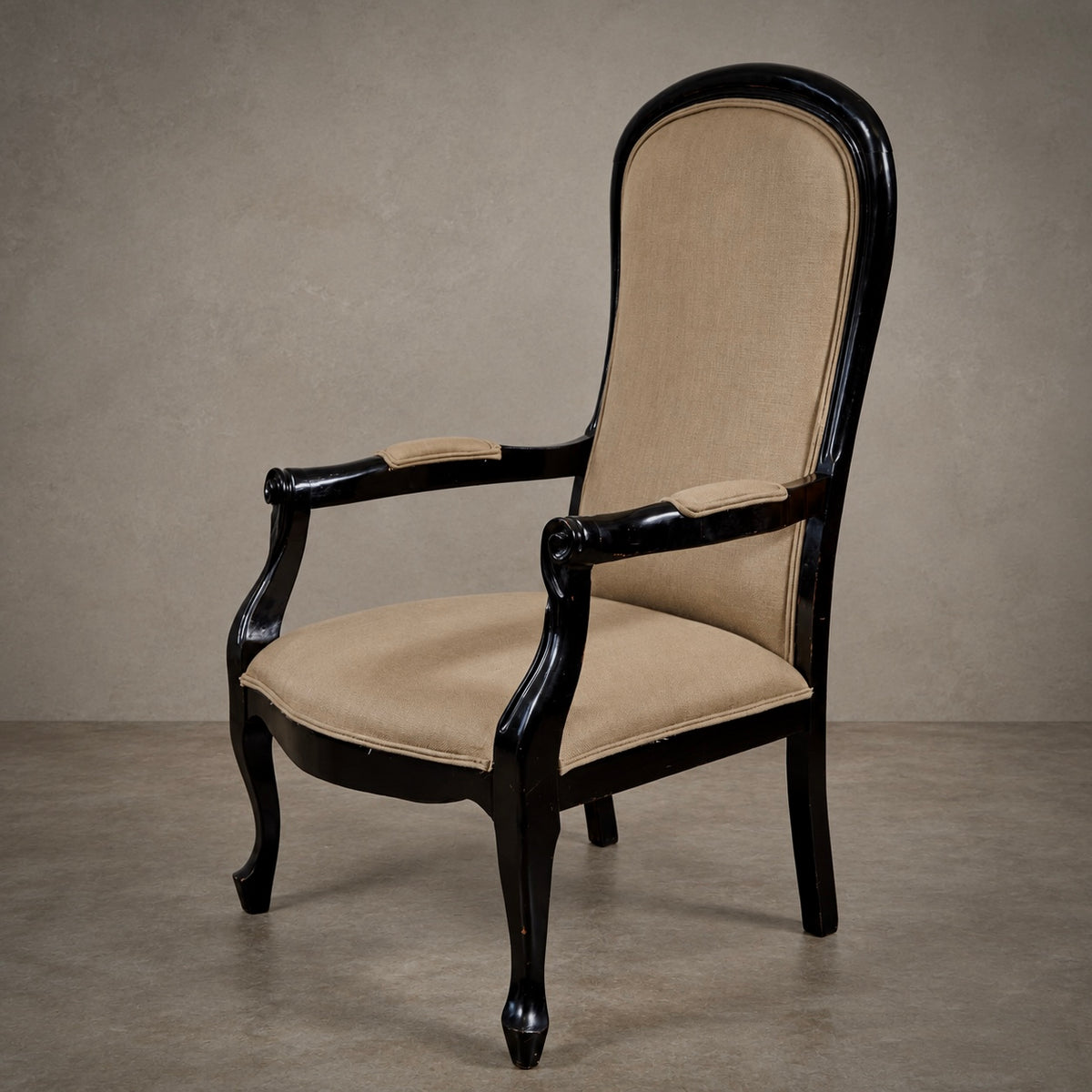 An elegant high-back armchair with a glossy black carved wooden frame and beige upholstered seat and backrest, set against a textured gray studio background.
