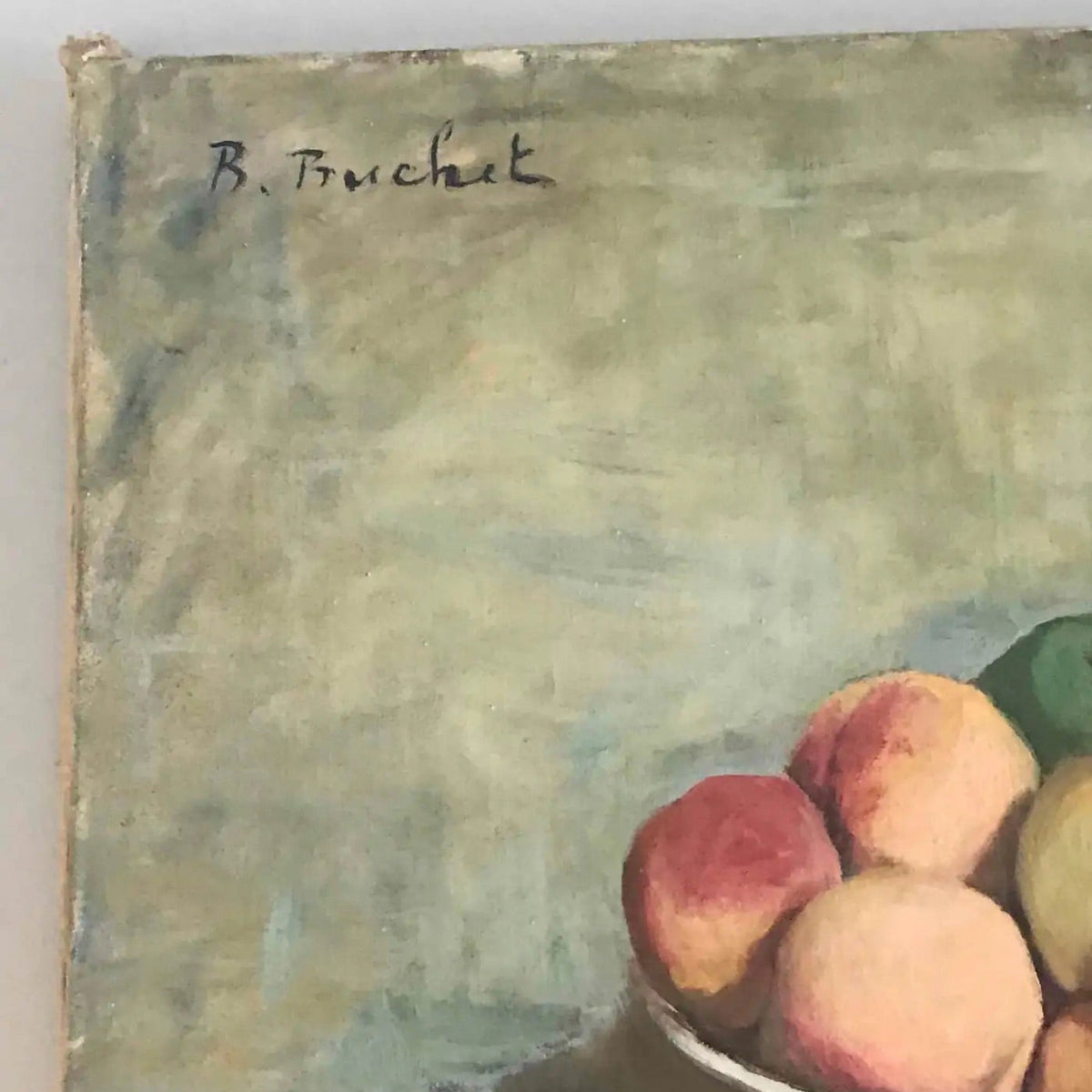 Close-up of artist name of an oil painting depicting a still life arrangement of fruits on a table.