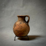 A VINTAGE TERRA-COTTA VESSEL