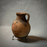 A VINTAGE TERRA-COTTA VESSEL