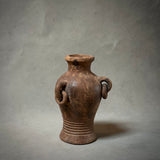 A decorative terracotta vessel