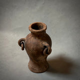 A decorative terracotta vessel