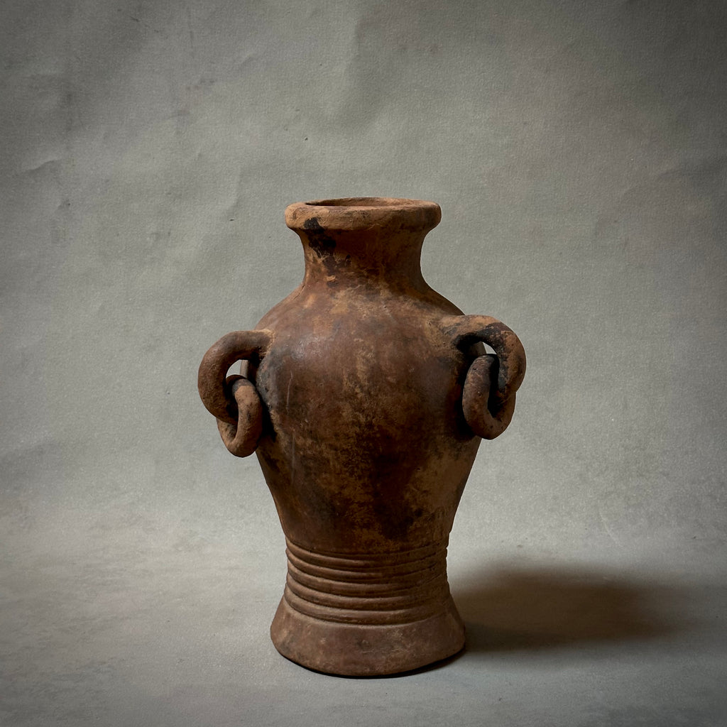 A decorative terracotta vessel