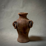 A decorative terracotta vessel