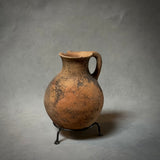 A VINTAGE TERRA-COTTA VESSEL