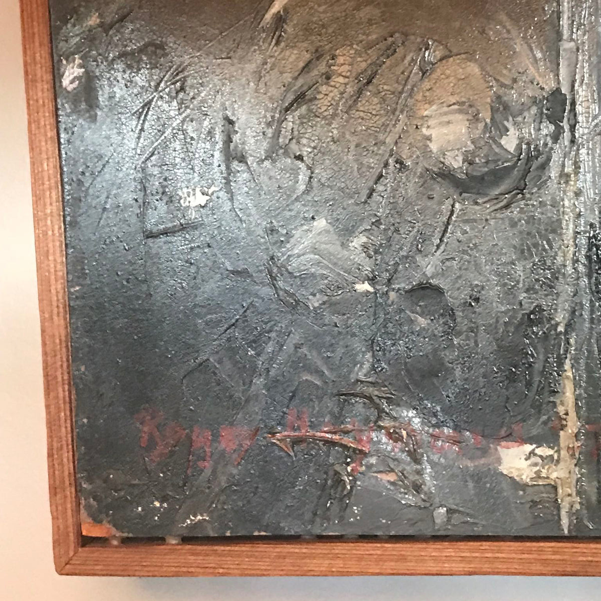 Close of artist signature on oil painting.