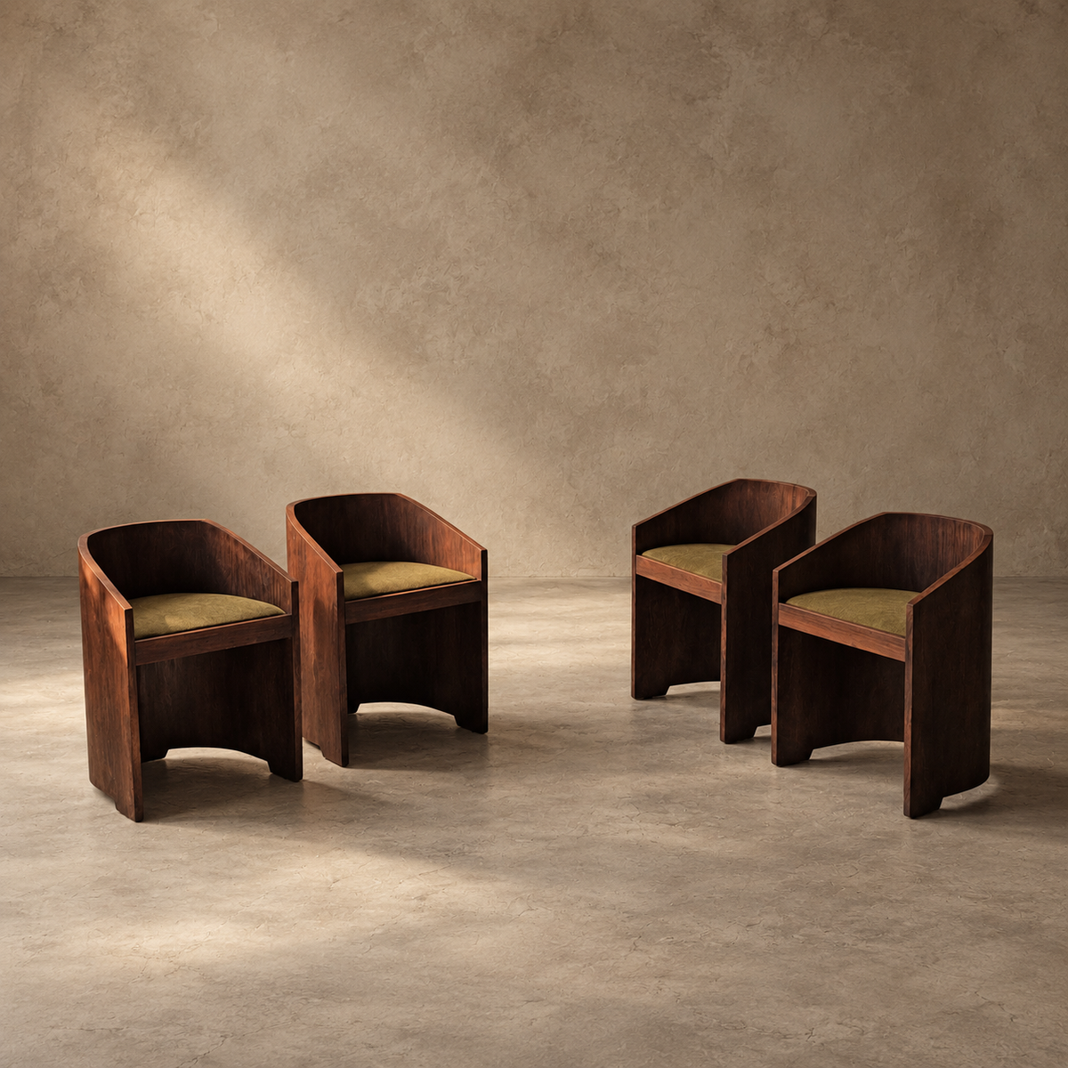 Four dark wood armchairs with olive green cushions arranged on a concrete floor against a textured beige wall.