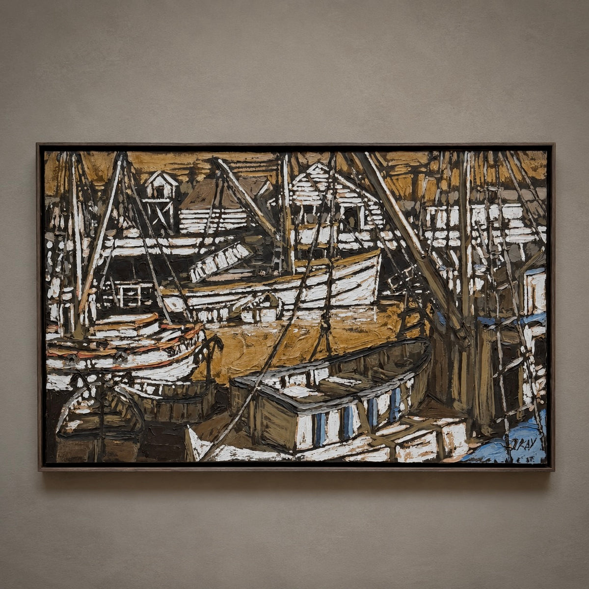 A framed horizontal canvas painting of a harbor scene with fishing boats and masts, rendered in earthy brown, beige, black, and white tones, hanging on a textured gray wall.
