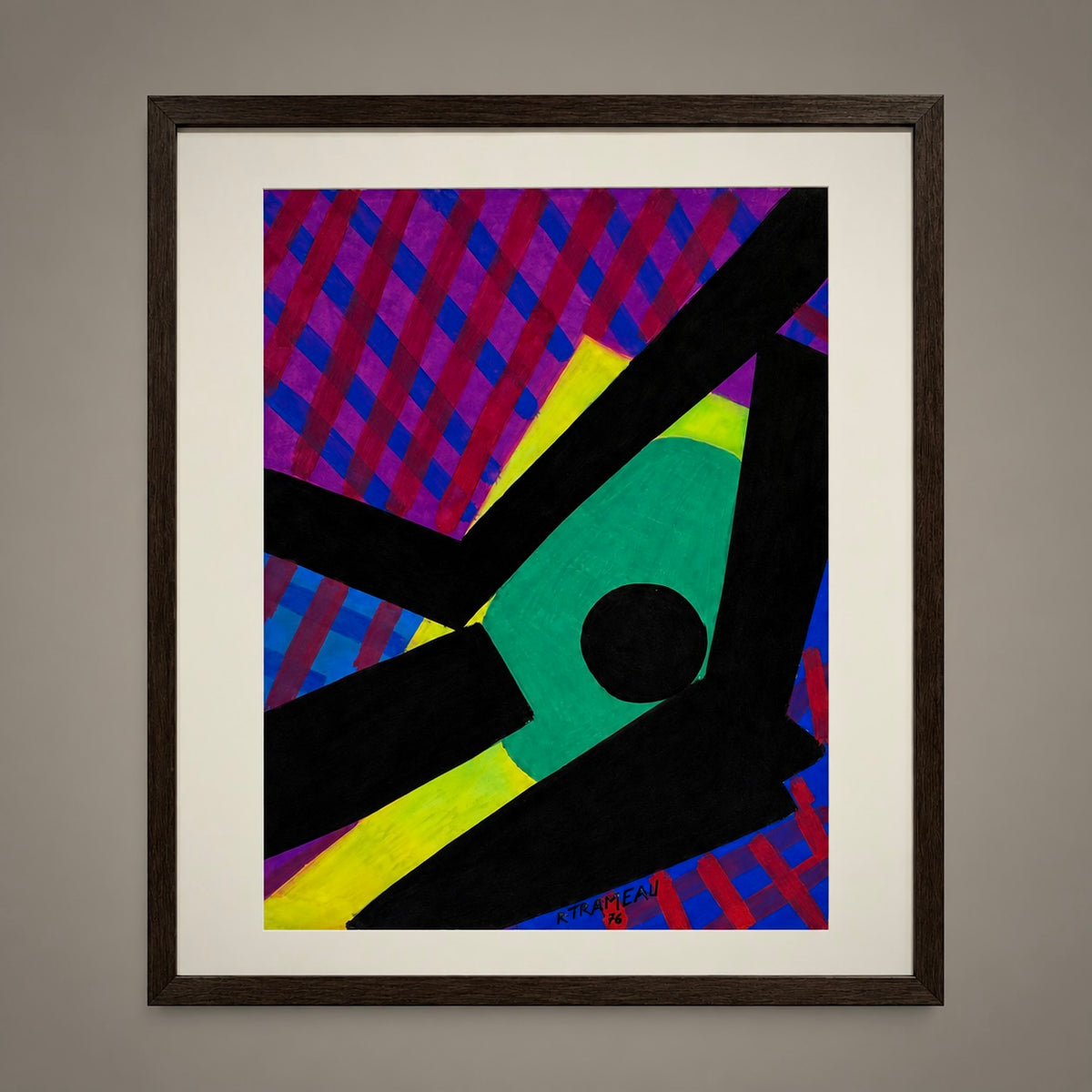 A framed abstract geometric art print featuring bold shapes in green, yellow, black, purple, and blue, mounted on a neutral gray wall.