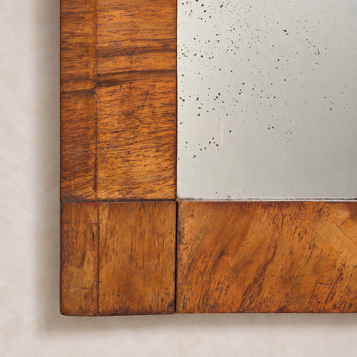 Close-up of wooden paneling with a concrete wall background