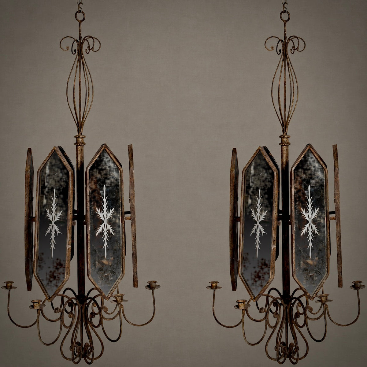 A pair of vintage-style multi-light chandeliers with distressed bronze metal frames and mirrored glass panels featuring white snowflake designs, set against a solid taupe background.