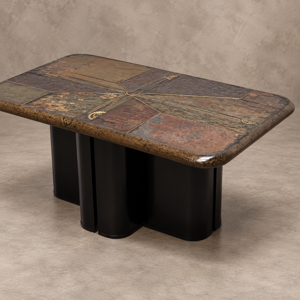 A modern rectangular coffee table with a multi-colored patchwork stone top and a black sculptural cylindrical base, set against a textured beige studio background.