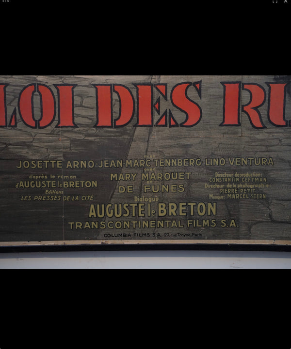 A vintage movie poster for the film 'Loi des Rivières' featuring cast names including Josette Arno, Jean Marc Tenberg, and Lino Ventura, printed on a dark textured background with bold red and gold lettering.