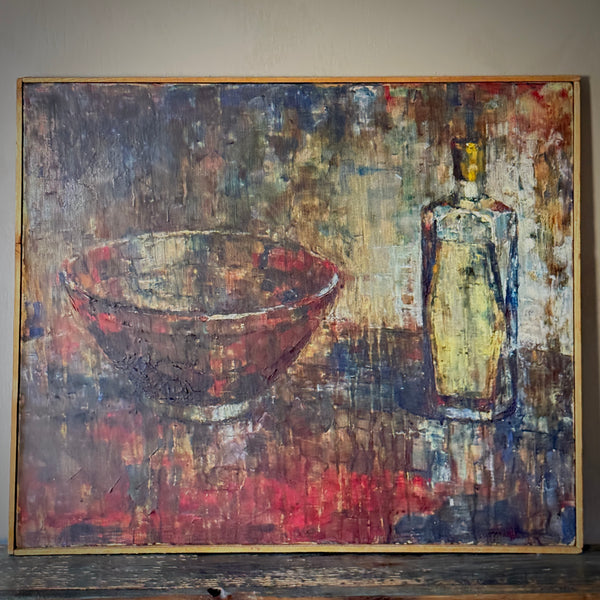 An oil painting featuring a bowl and a glass bottle against a colorful background, housed in a thin wooden frame. 