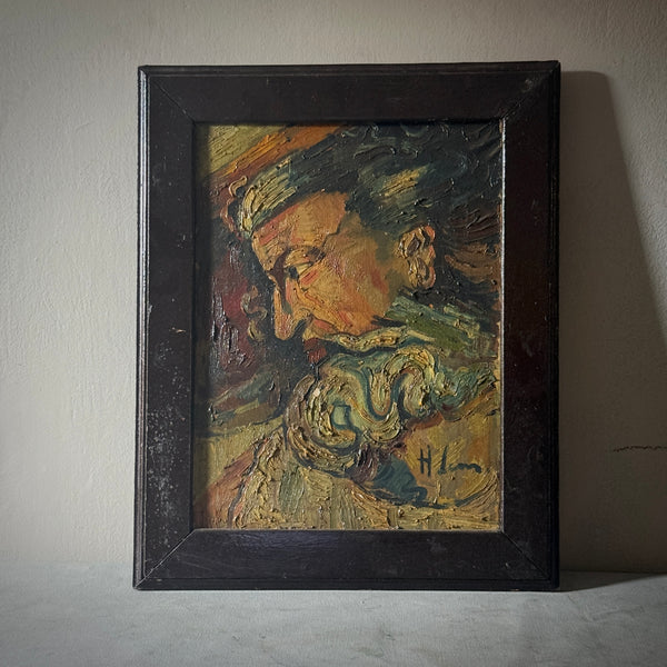 Framed oil painting of a bearded man, rendered in thick, expressive strokes, on a light surface.