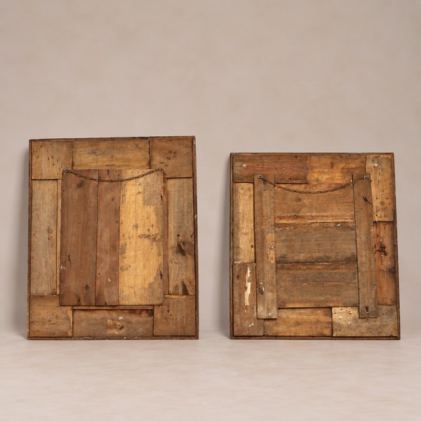 Two rustic rectangular wooden wall art frames made from patched wood planks, shown side by side against a plain warm beige studio background.