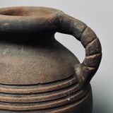 A decorative terracotta vessel